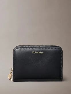 Calvin Klein naisten lompakko CK Medium Flap Zip Around, musta