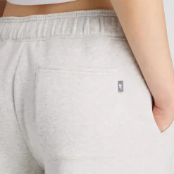 New Balance naisten collegehousut Linear Heritage Fleece Barrel Pant, vaaleanharmaa